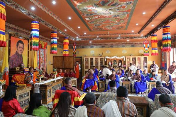 Bhutanese officials in traditional dress at a ceremony